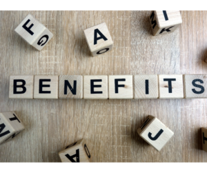 The word Benefits spelt out with scrabble tiles