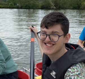 a photo of alex rowing on a bell boat