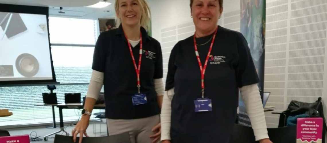 Rebecca and Gill stood behind a Berkshire Vision stall